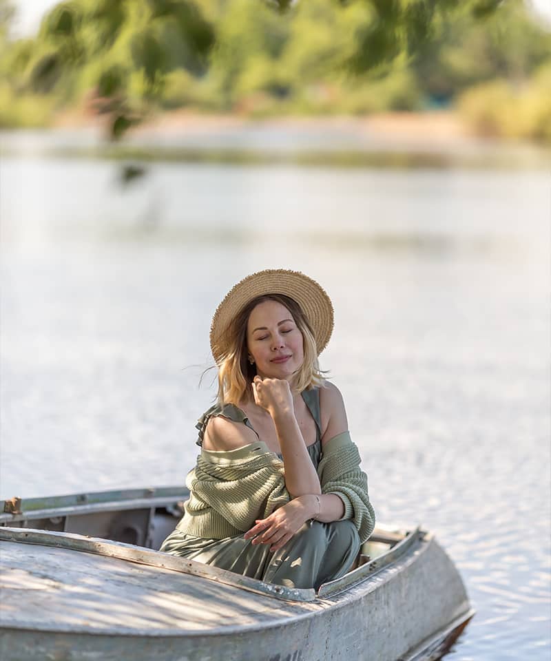 young-girl-boating-on-the-lake-in-summer