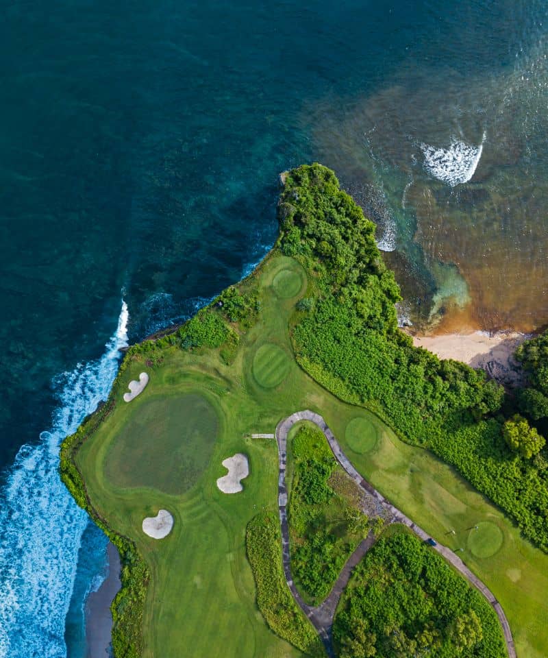 aerial-view-of-golf-course-with-green-at-coast