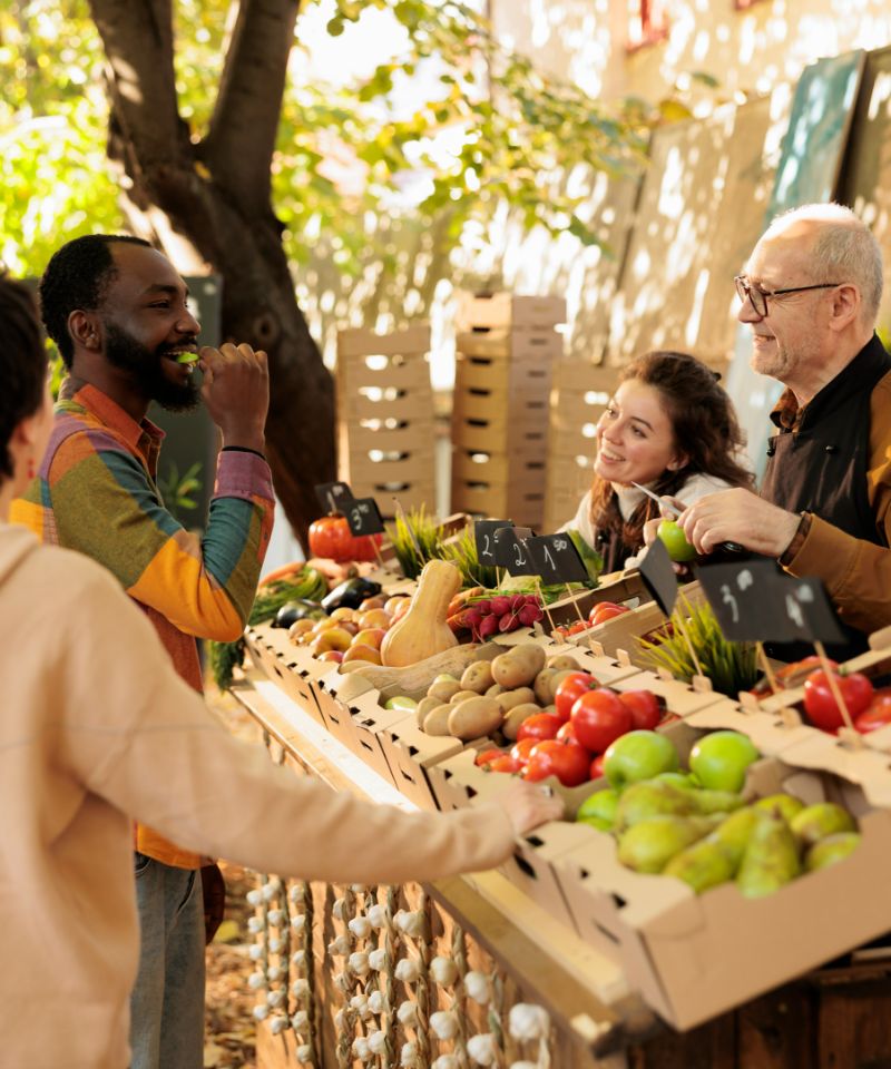 african-guy-tasting-fresh-organic-produce