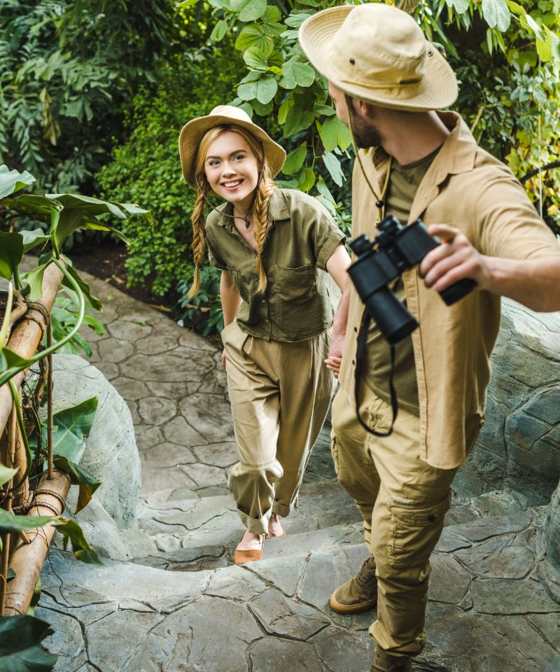 beautiful-young-couple-in-safari-suits-hiking
