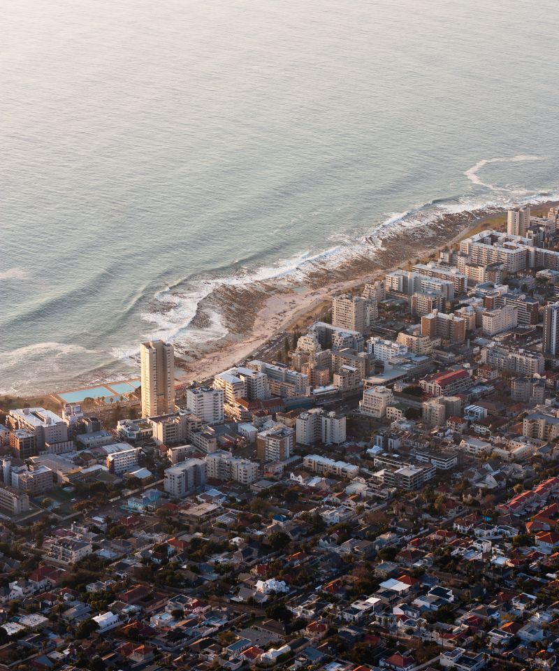 aerial-shot-of-a-lot-of-high-buildings-on-the-shor-2023-11-27-05-32-14-utc